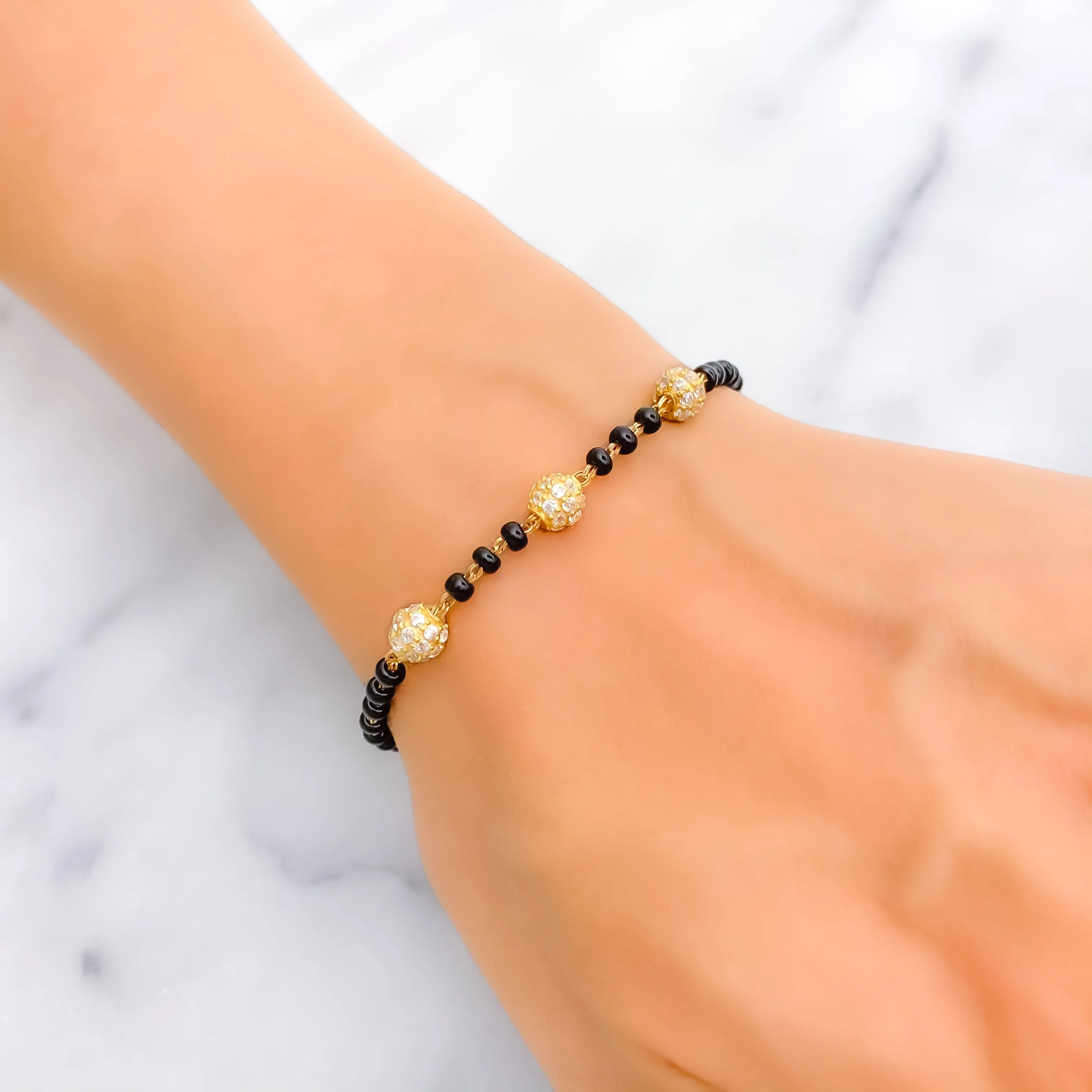 Elegant Orb 22k Gold Black Bead Bracelet