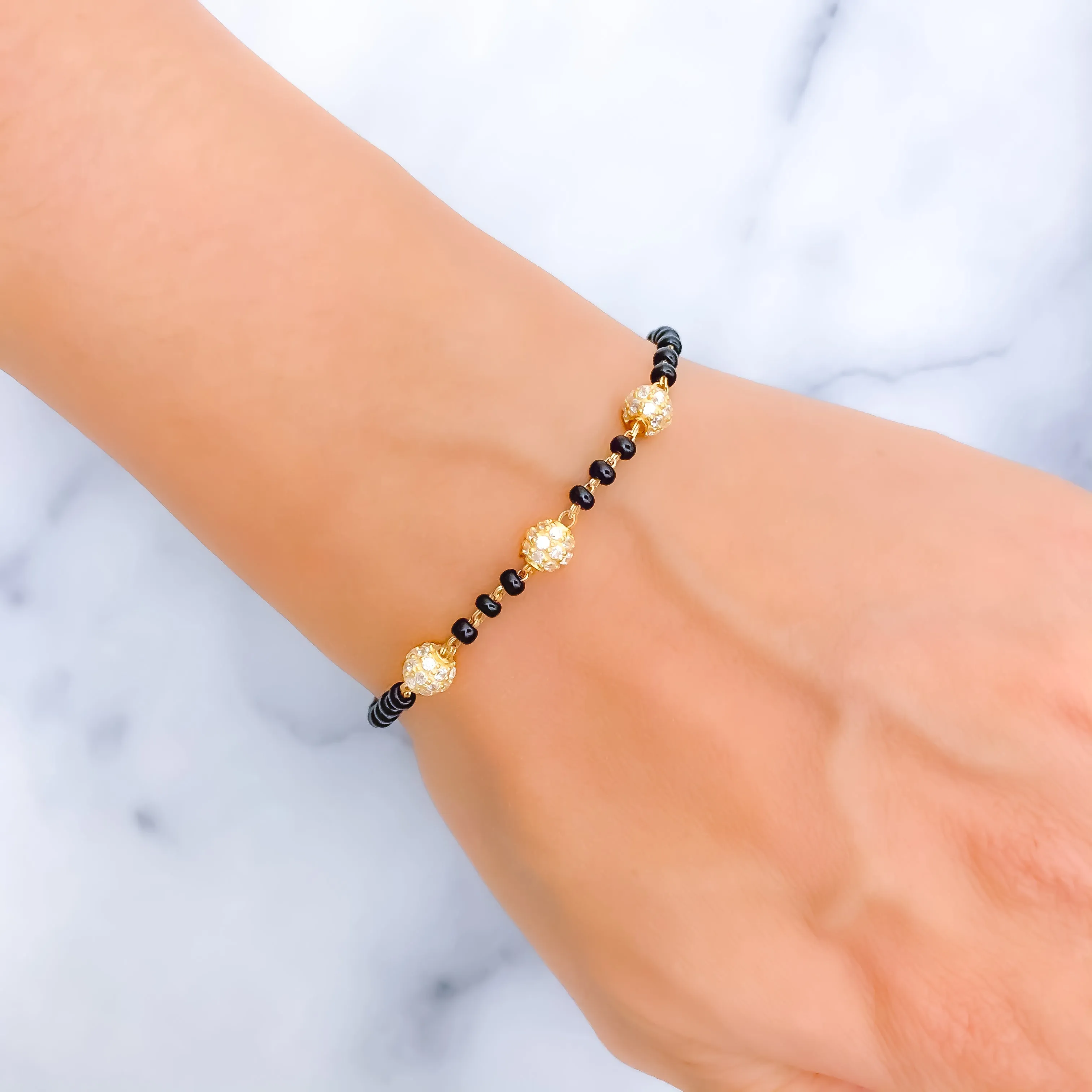Elegant Orb 22k Gold Black Bead Bracelet