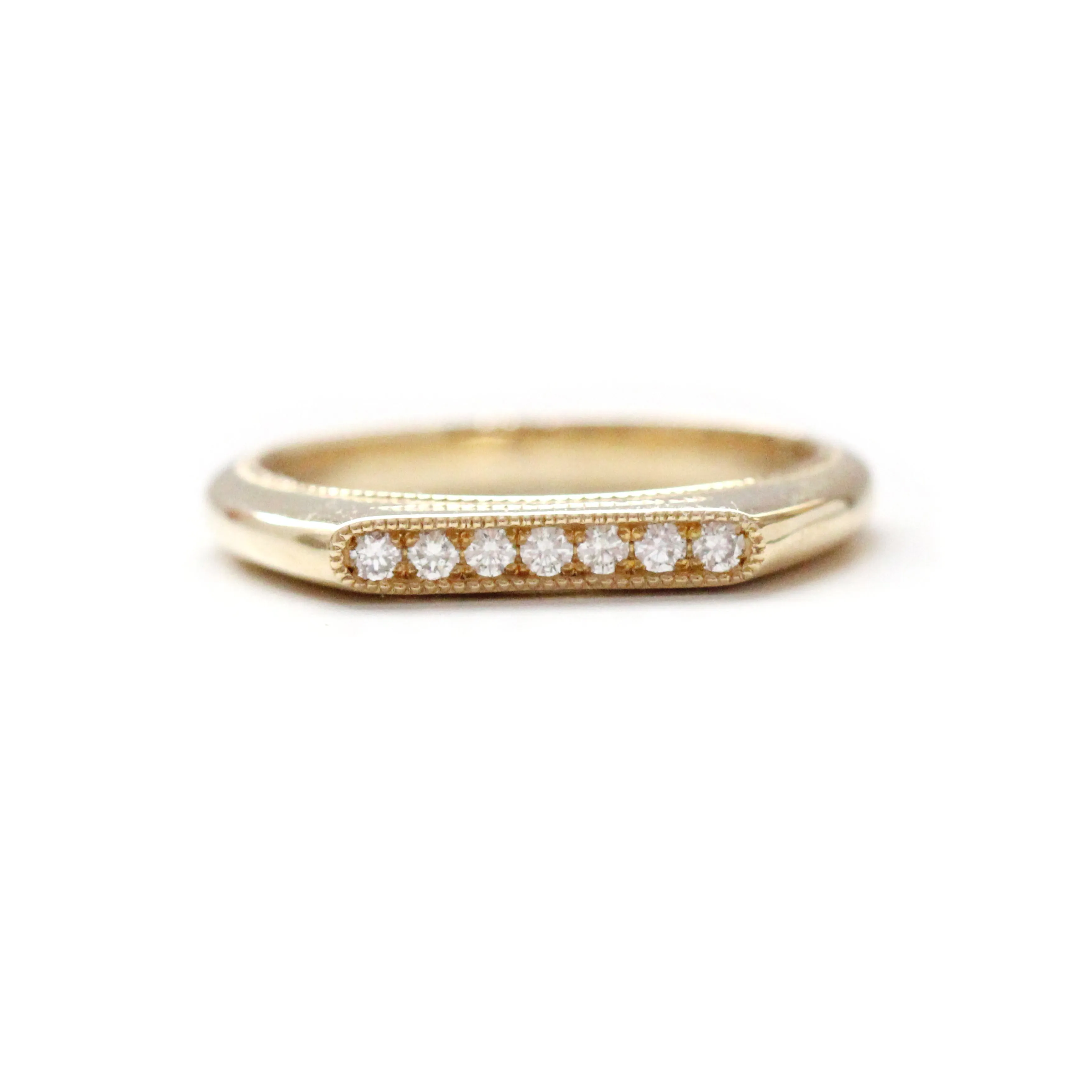 Elongated oval pave set diamond signet band